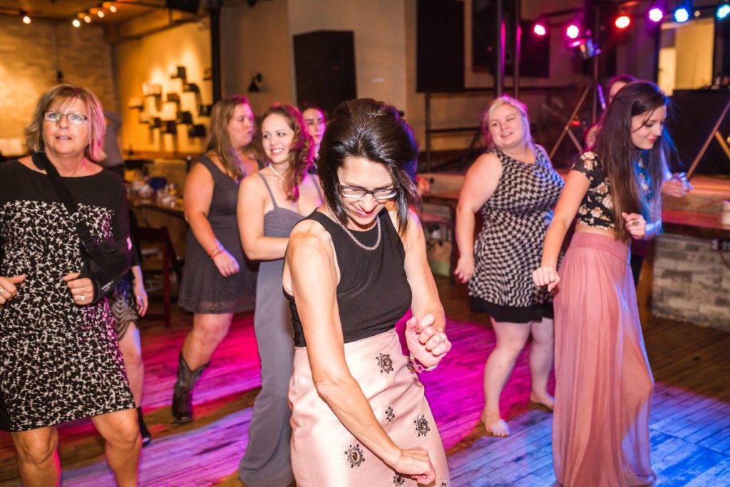 wedding guests on the dance floor dancing to Milwaukee underground productions DJ Service