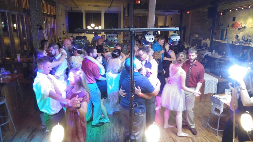 Wedding Guests slow dancing at Anodyne Coffee In Bay View Wisconsin Wedding Event Space DJ Services from Milwaukee Underground Productions