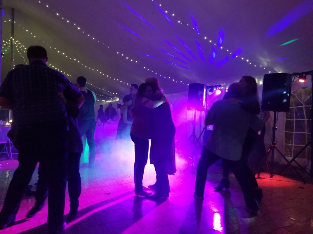DJ Lighting with Fog machine at a backyard tented wedding in Wisconsin