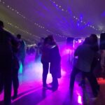 DJ Lighting with Fog machine at a backyard tented wedding in Wisconsin